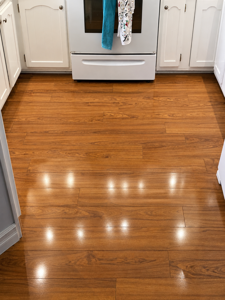 Fresh laminate flooring installed in a kitchen.